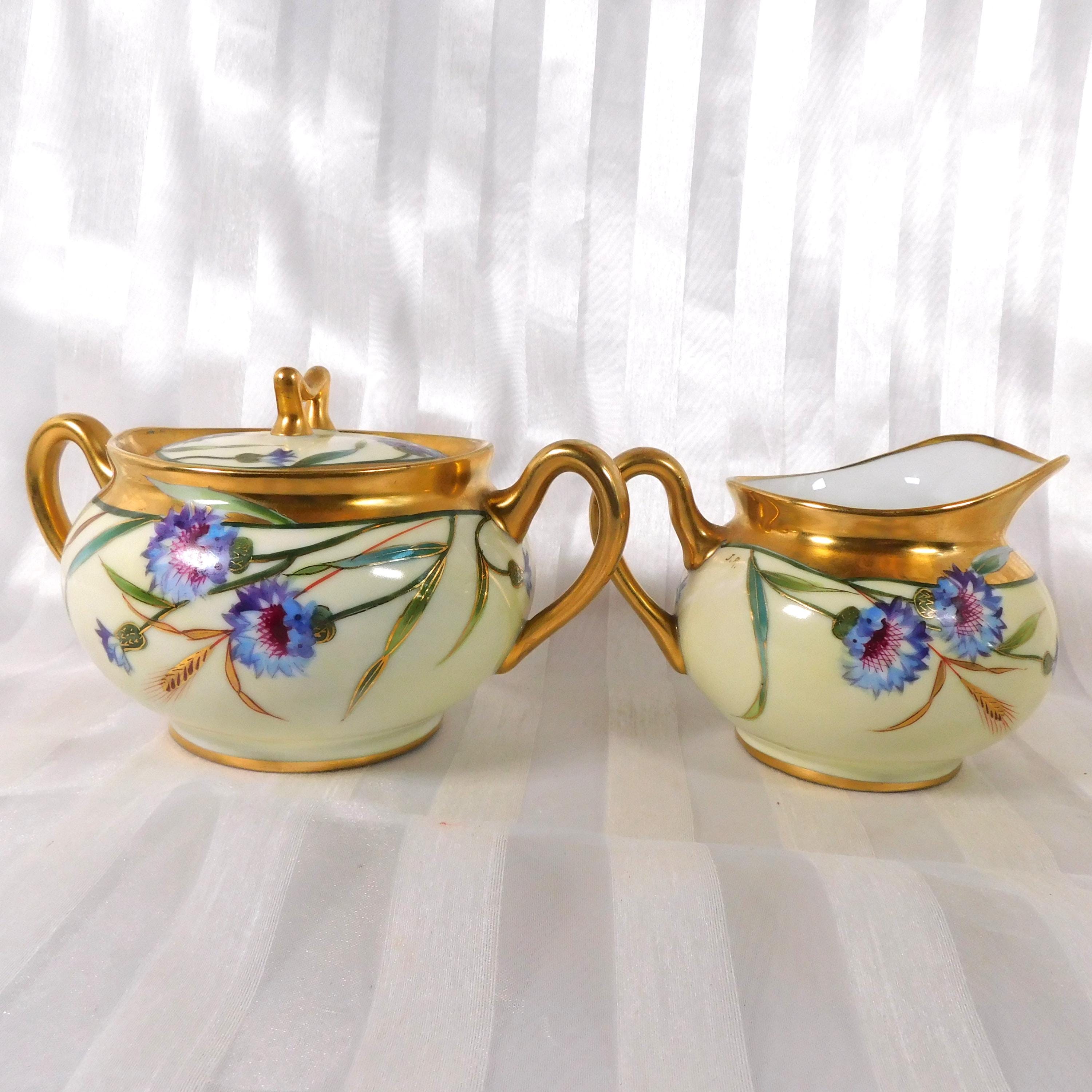 Cream and Gold Floral Sugar Bowl and Creamer Marked SW Donath # 26175