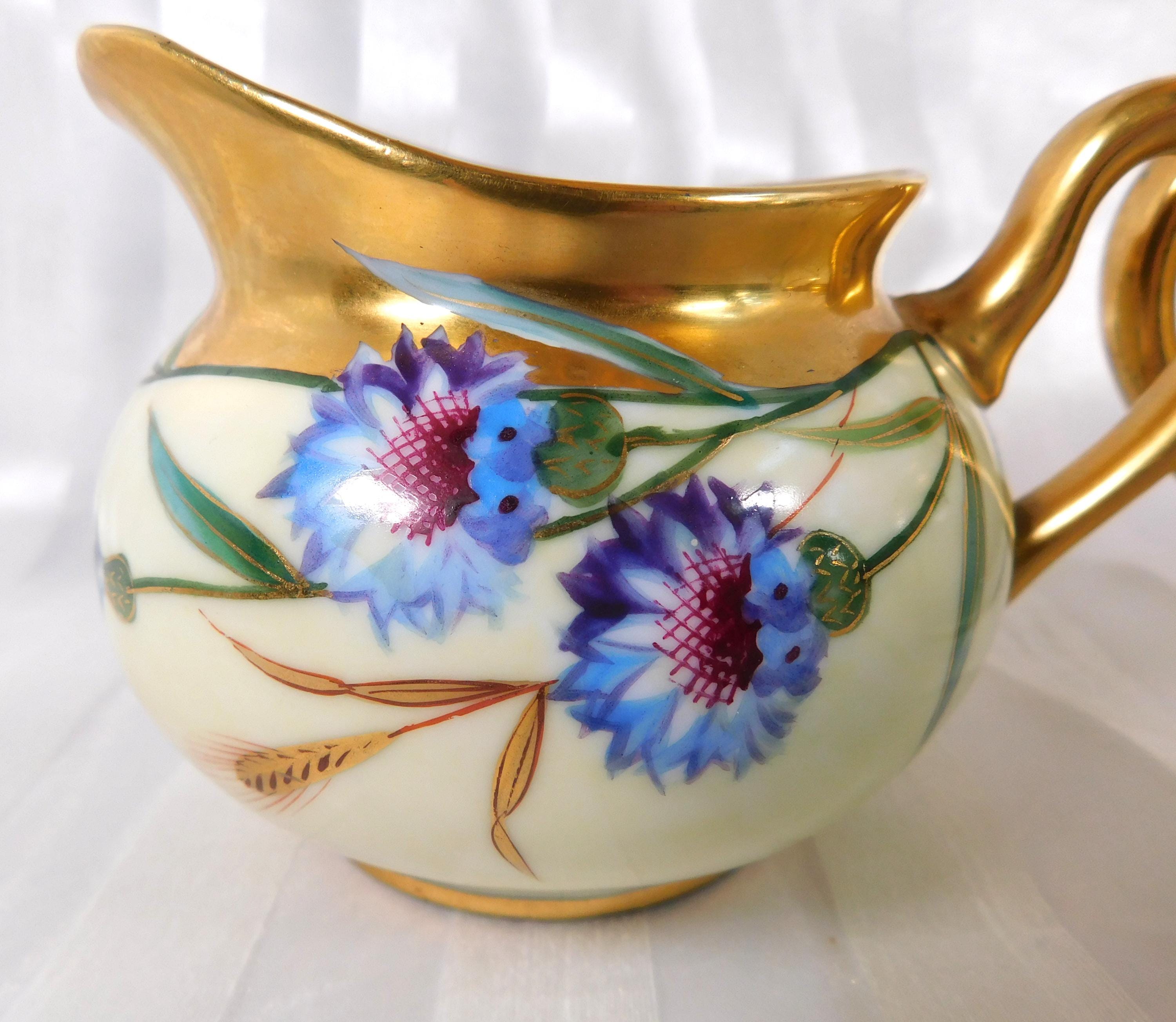 Cream and Gold Floral Sugar Bowl and Creamer Marked SW Donath # 26175