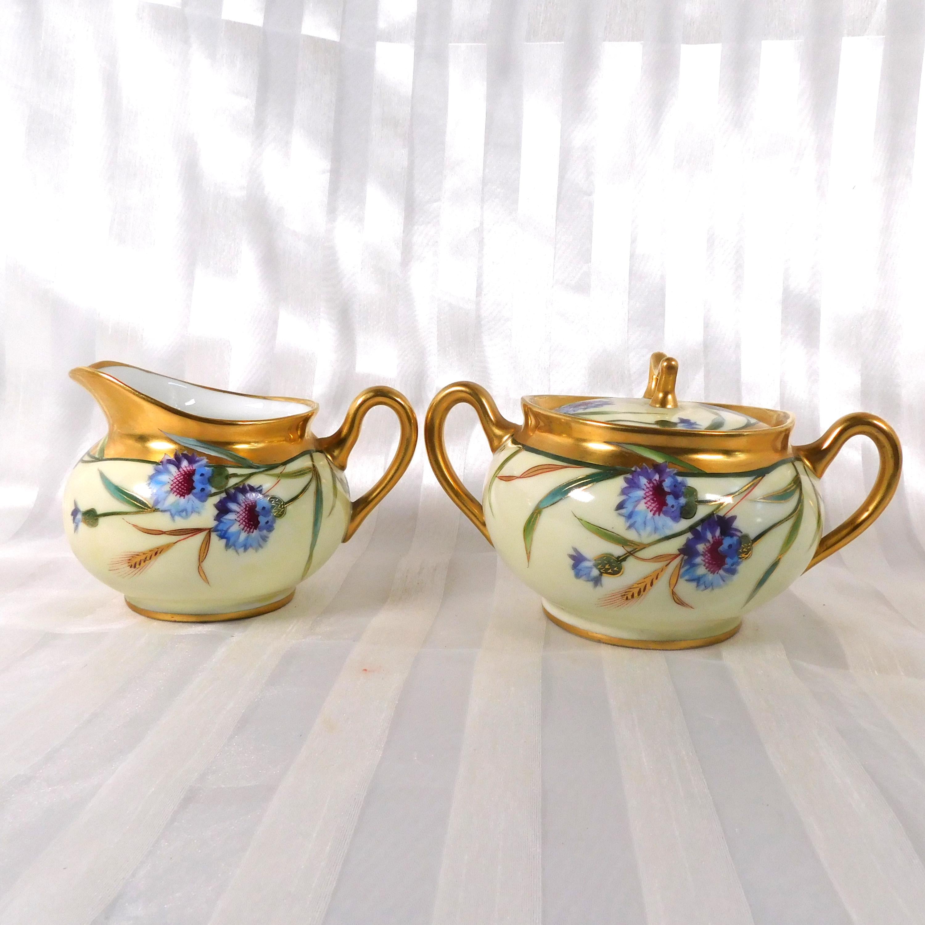 Cream and Gold Floral Sugar Bowl and Creamer Marked SW Donath # 26175