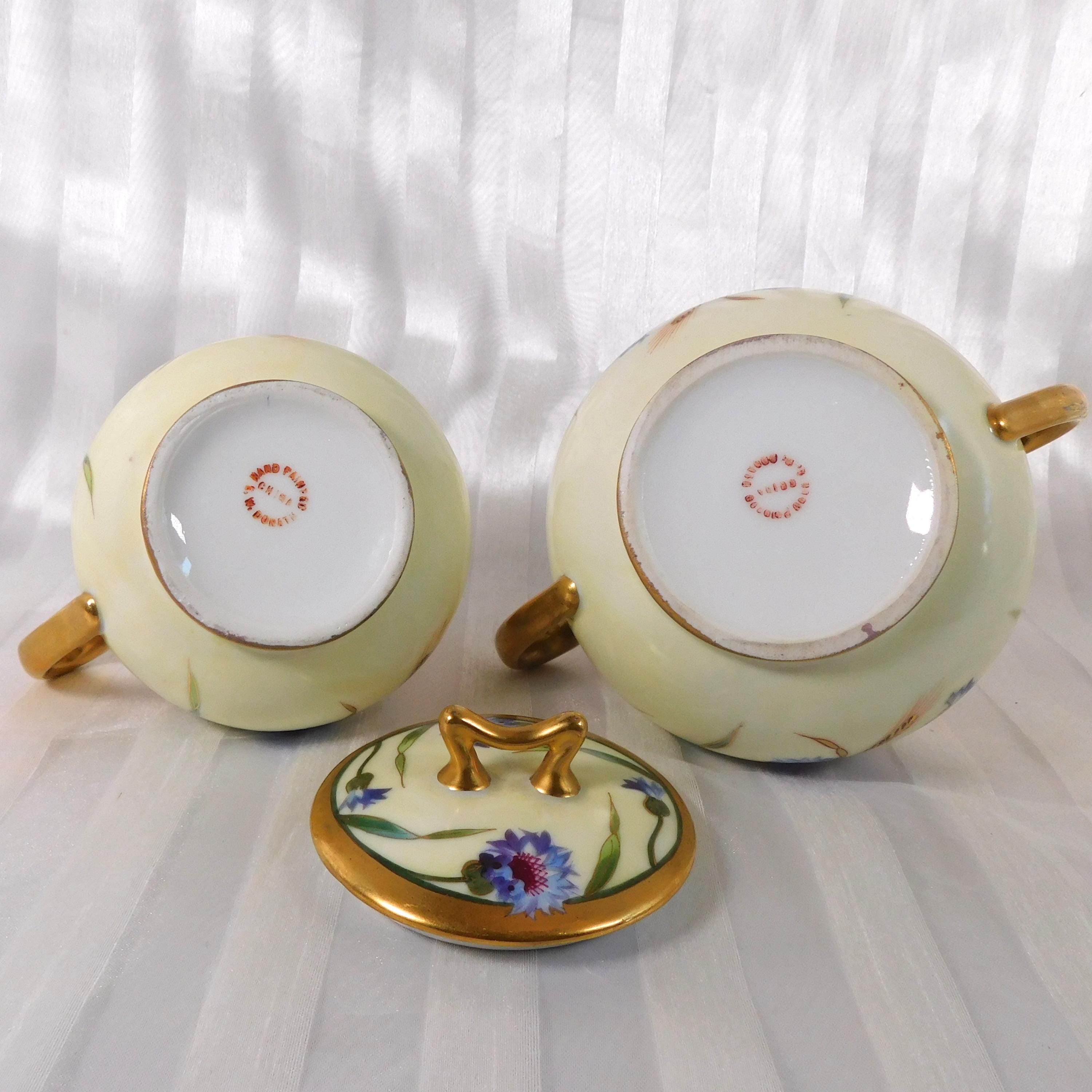 Cream and Gold Floral Sugar Bowl and Creamer Marked SW Donath # 26175